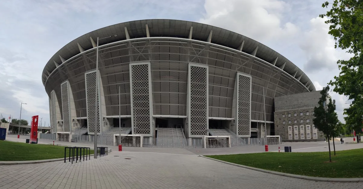 Modern architecture of Puskás Aréna in Budapest, Hungary, showcasing its grand stadium design.