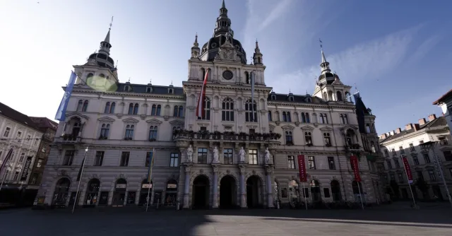 Front view of Graz Town Hall at Hauptplatz in morning light, showcasing classic architecture.