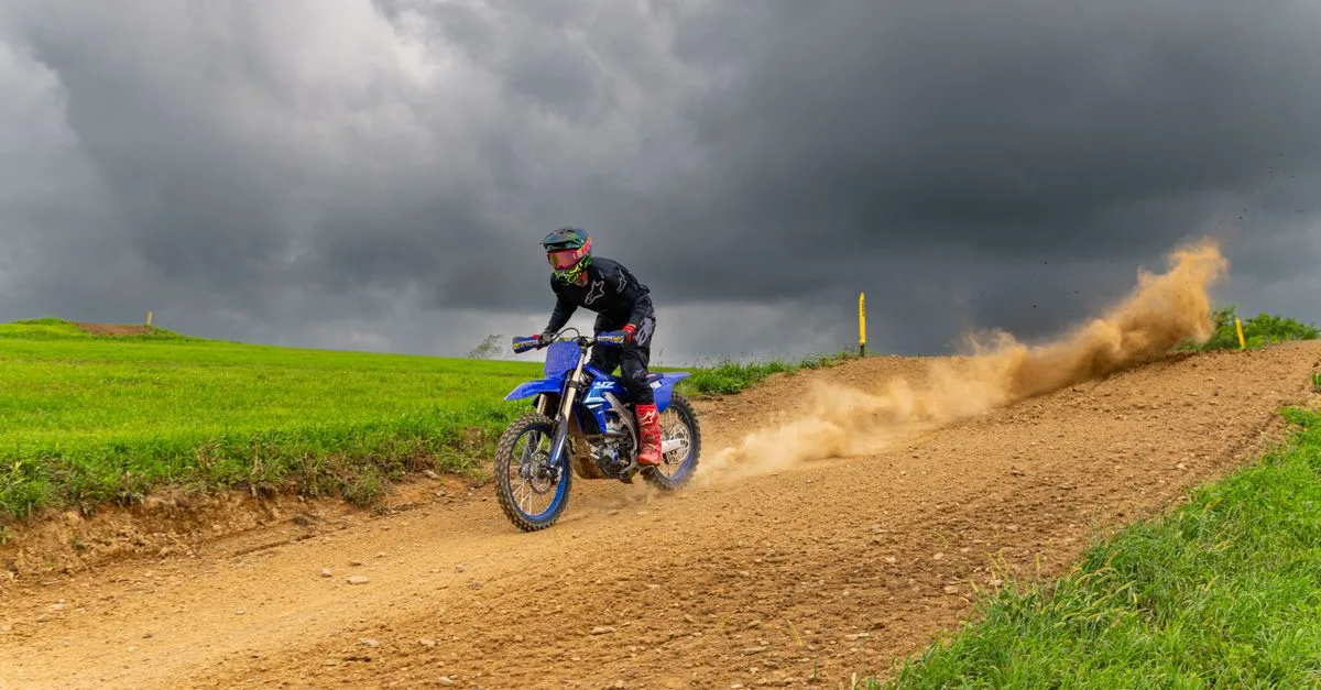 Exciting dirt bike racing on a stormy day in Pennsylvania's countryside.