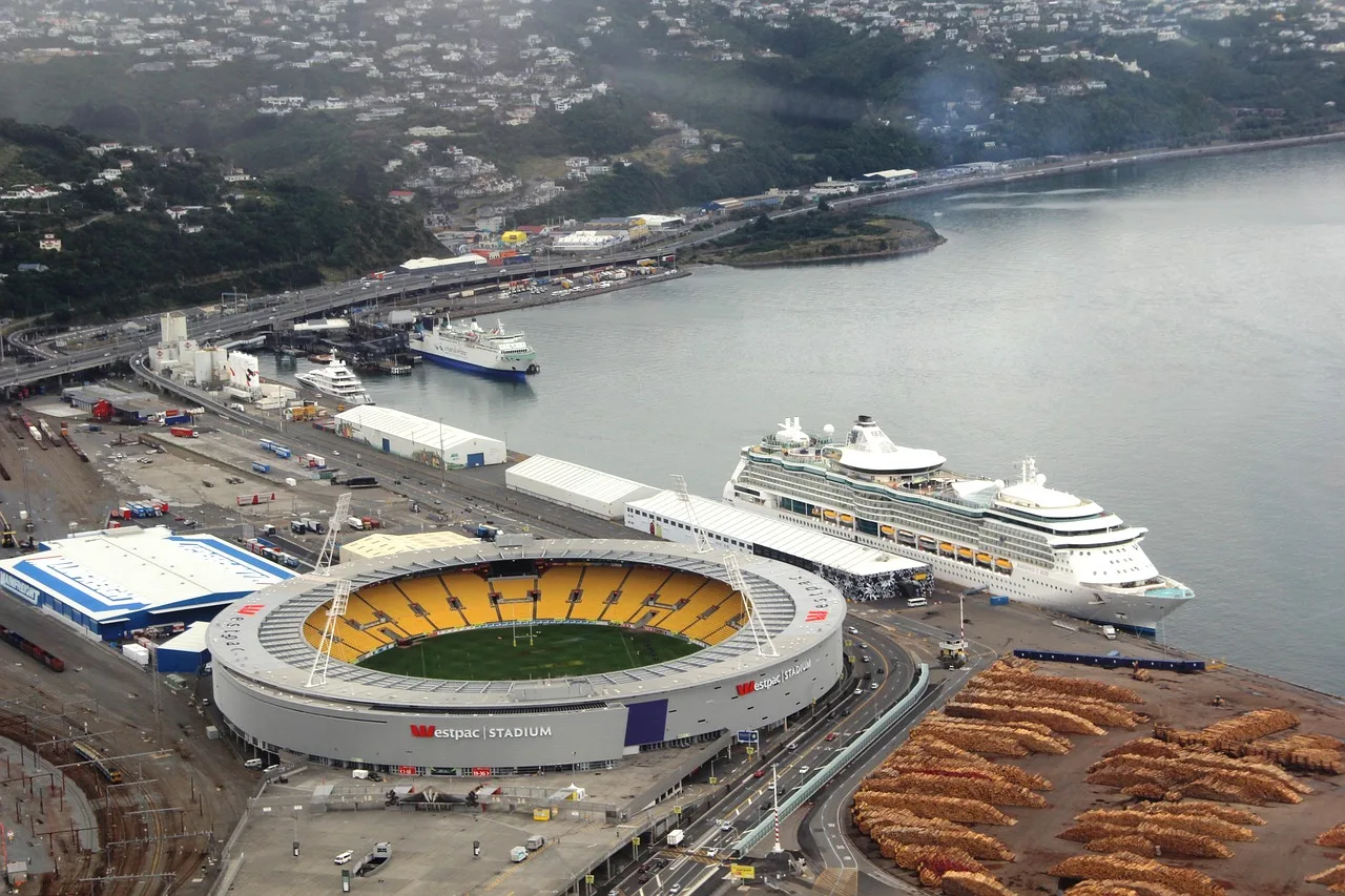 A professional cricket stadium under clear skies.