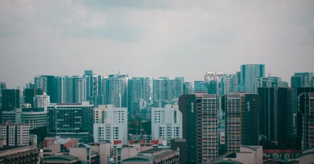 A stunning cityscape view of Singapore's high-rise buildings under a cloudy sky, showcasing urban architecture.