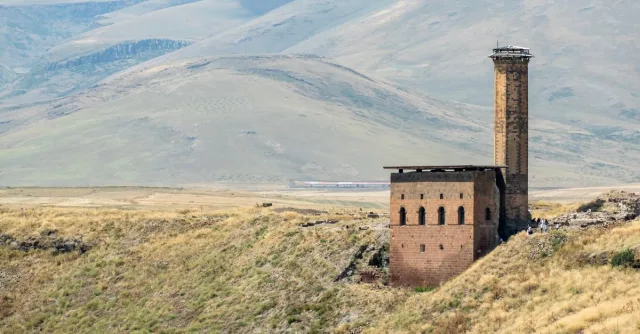 Scenic view of Ani ruins in Kars, Türkiye, showcasing medieval architecture amid mountainous landscape.