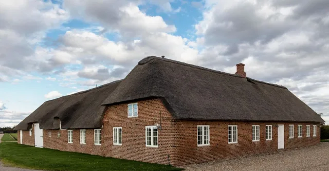Explore this picturesque Nordic thatched cottage set in the idyllic Danish countryside.