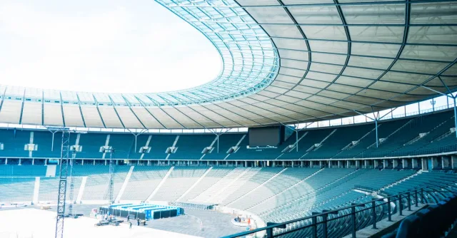 Bright and airy empty stadium in Berlin with modern architecture.