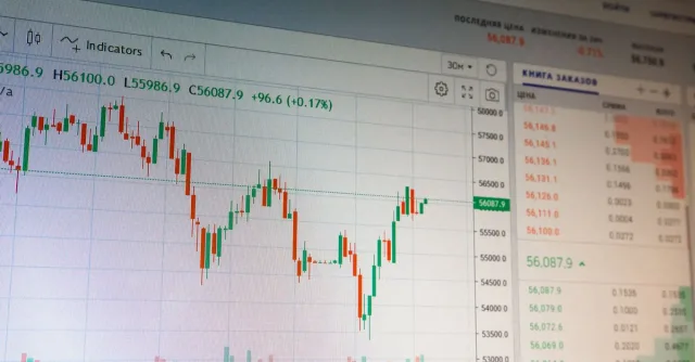 Close-up of digital cryptocurrency market graph showing price fluctuations and trading data.