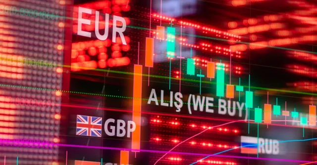Dynamic forex trading concept with currency symbols and candlestick chart illuminated on screen.