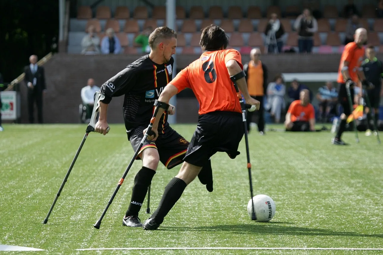 A close-up of a professional football field showing the lush green turf of a stadium.