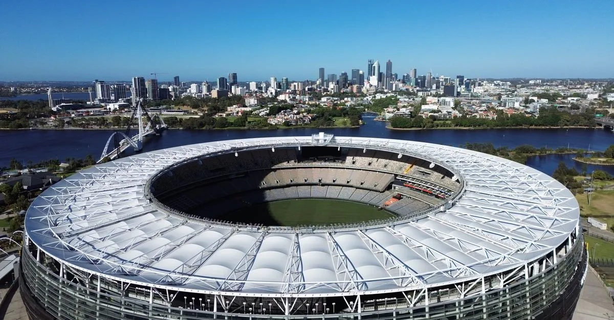 Stunning aerial view of Optus Stadium in Perth, Western Australia with city skyline backdrop.