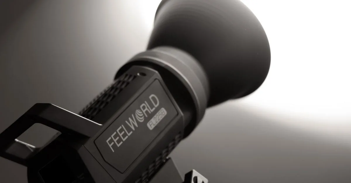 Close-up of professional studio light Feelworld FL225B with lens flare effect.