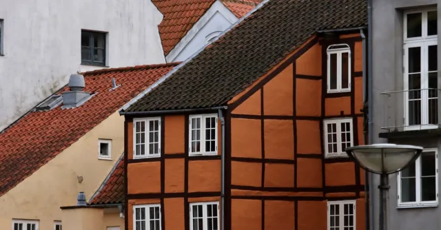 Historic facades and roofs in Helsingør, Denmark capture classic Danish architecture.