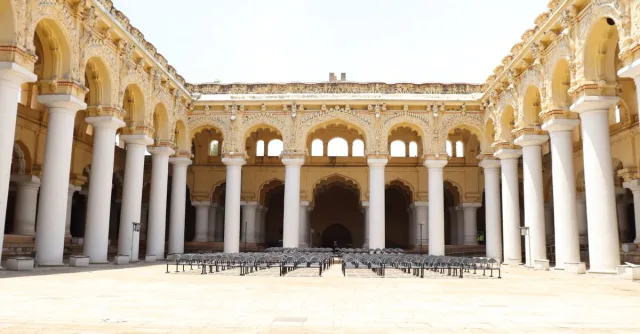 Majestic courtyard of Thirumalai Nayakkar Palace, a historic structure in Madurai, Tamil Nadu.