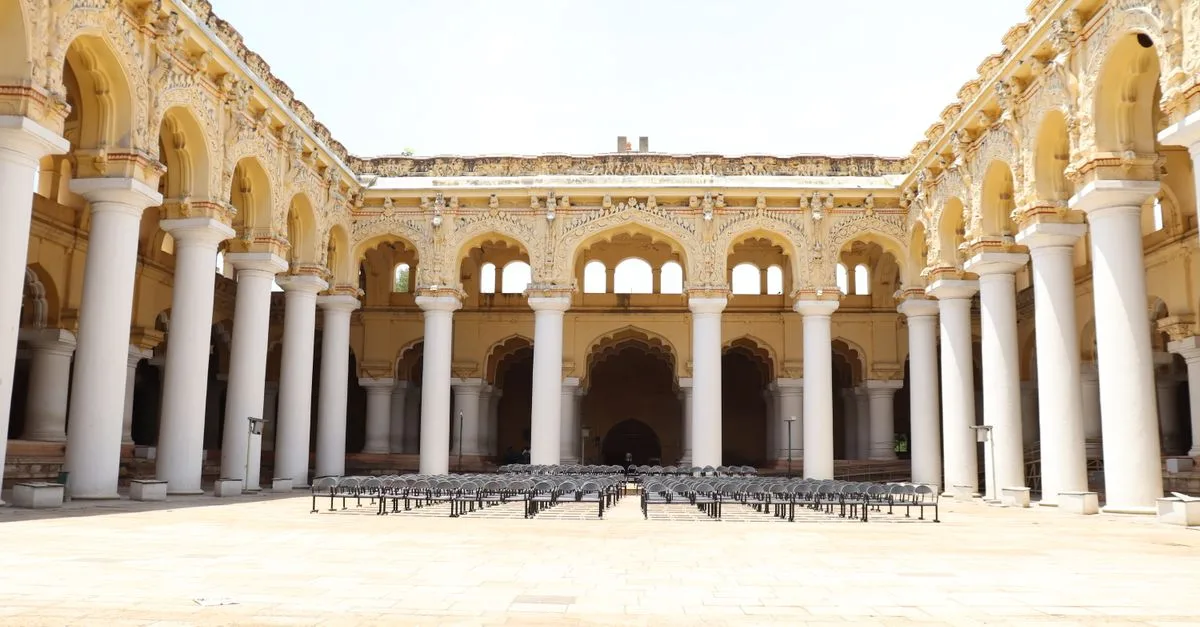 Majestic courtyard of Thirumalai Nayakkar Palace, a historic structure in Madurai, Tamil Nadu.