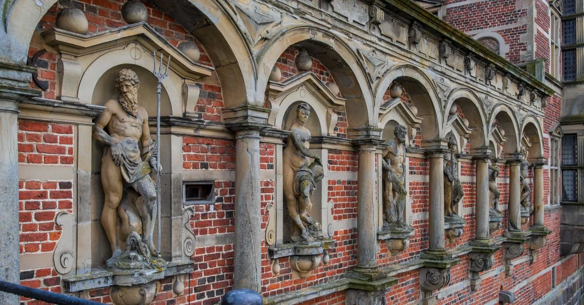 Detail view of sculptures at Frederiksborg Castle, Hillerød, Denmark, showcasing Renaissance architecture.