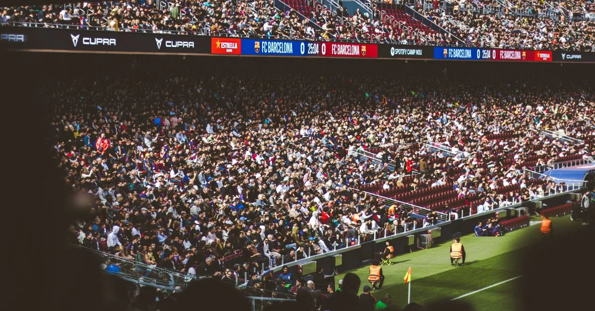 A bustling crowd enjoying a football match at Camp Nou Stadium, Barcelona.