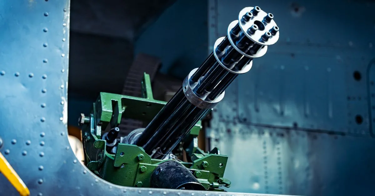 Detailed view of a gatling gun mounted on a military vehicle, showcasing mechanical design.