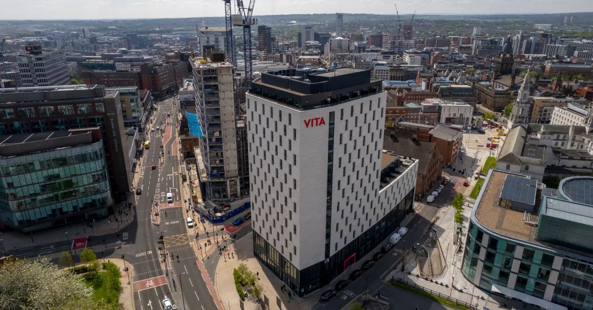 Aerial shot capturing modern architecture in Leeds, England under sunny skies.