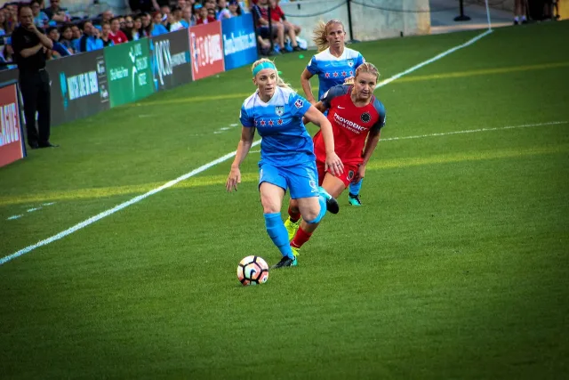 A wide view of a modern professional soccer stadium during a match.