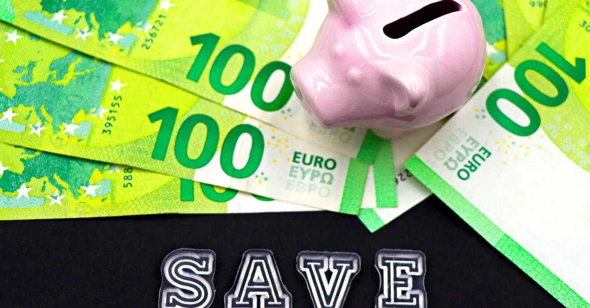 A piggy bank on euro bills with 'save' text highlights money saving concepts.