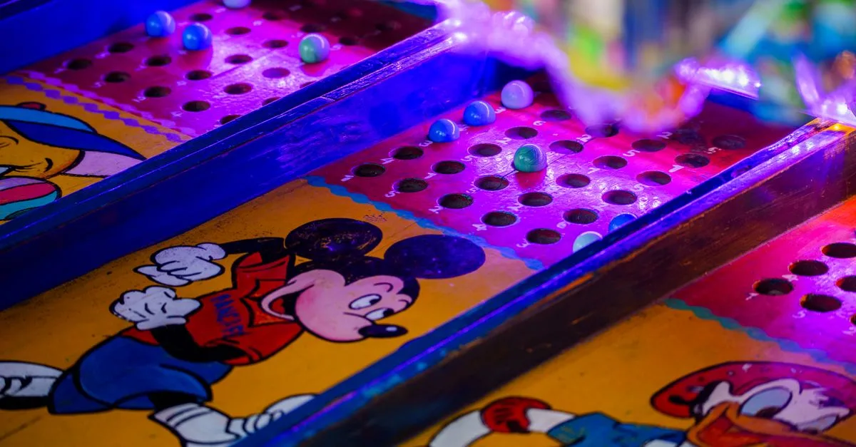 Vibrant arcade game featuring iconic cartoon characters under colorful lighting.