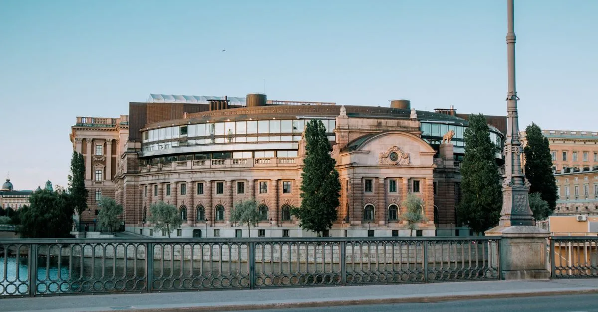 Scenic view of the Swedish Parliament building in Stockholm by the waterfront.