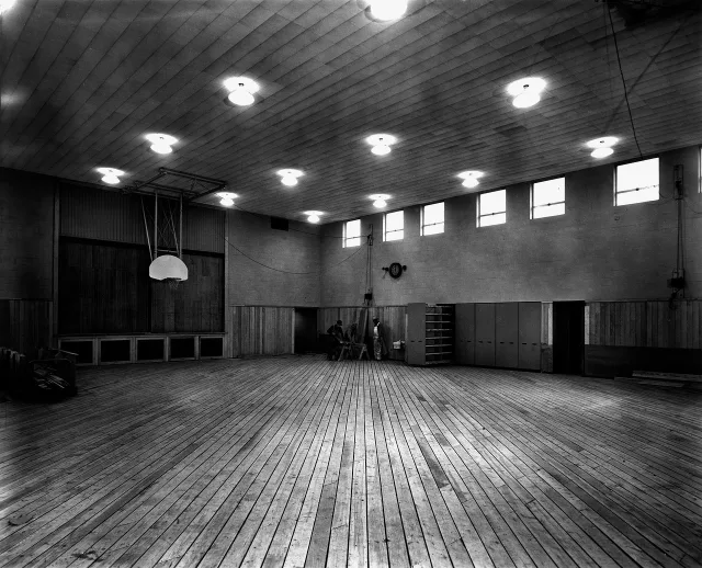 A professional basketball court viewed from the sideline.