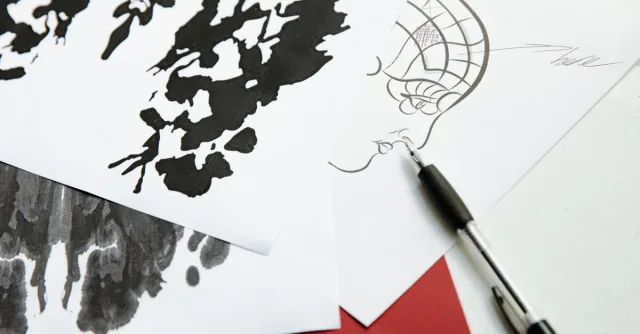 Black and white abstract ink drawings on paper with pen, showcasing artistic creativity.