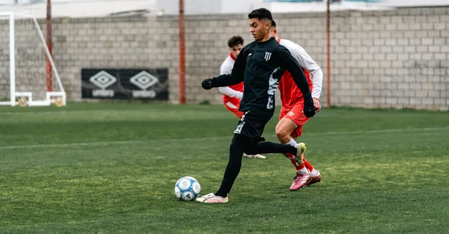 Action shot of athletes playing a competitive soccer game outdoors.