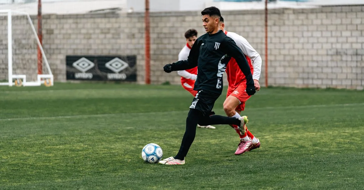 Action shot of athletes playing a competitive soccer game outdoors.