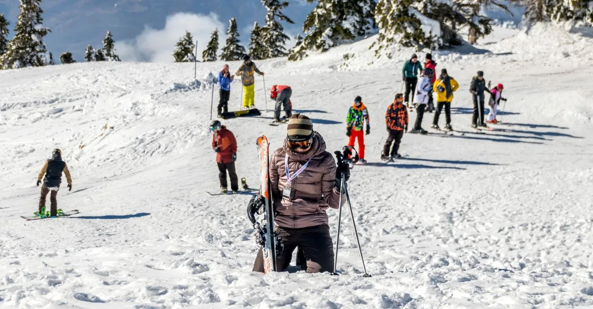 Group of skiers enjoying a sunny winter day on the snowy slopes of Bursa, Turkey.