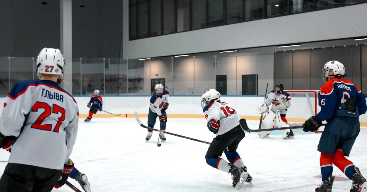 Action-packed ice hockey game with players competing in an indoor arena.
