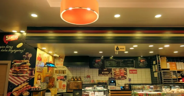 Cozy café interior with a variety of pastries and a warm, inviting atmosphere.