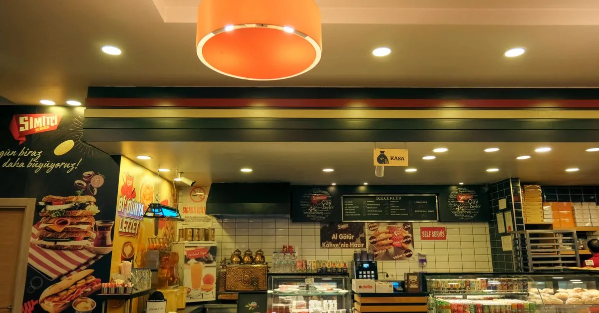 Cozy café interior with a variety of pastries and a warm, inviting atmosphere.