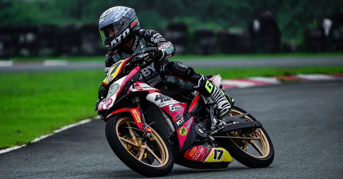 Professional motorcycle racer on a track in Tarlac City, showing dynamic speed and agility.