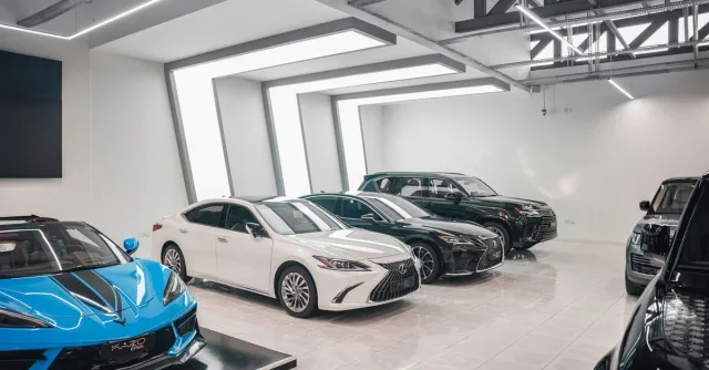 Sleek luxury cars showcased in a stylish, modern automotive dealership.