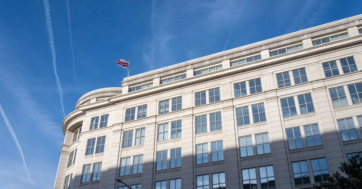 Elegant office building under a clear blue sky in Washington, D.C.