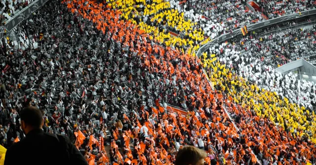 Vibrant fan sections create a striking pattern at a stadium in Munich.