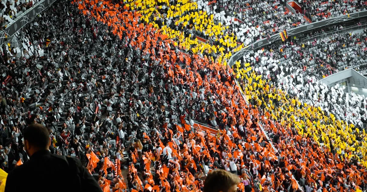 Vibrant fan sections create a striking pattern at a stadium in Munich.