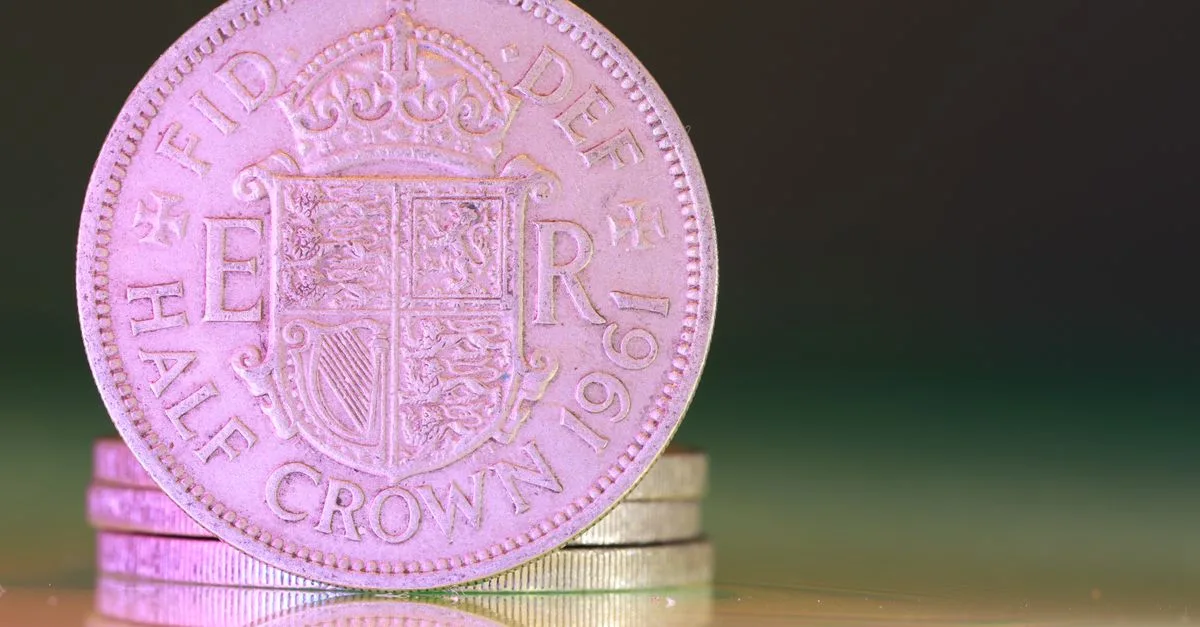 Detailed macro shot of a 1961 British half crown coin, showcasing historical design.