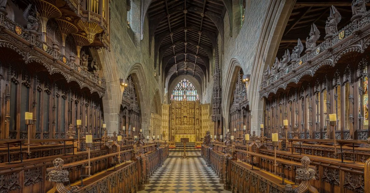 Stunning Gothic cathedral interior featuring intricate wooden choir stalls and ornate arches.