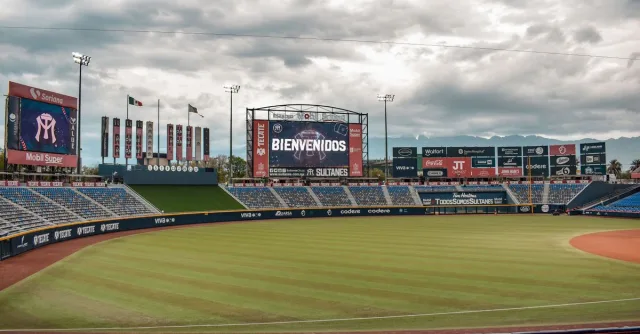 Empty baseball stadium in Monterrey, Mexico with electronic welcome sign.