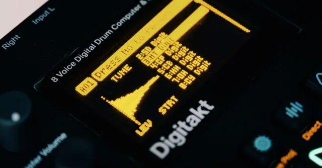 Close-up view of an Elektron Digitakt drum machine with visible OLED display and controls.