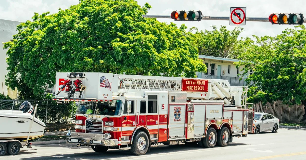 City of Miami fire-rescue truck with dive team module on a sunny street.