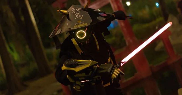 A captivating image of a futuristic samurai warrior cosplay illuminated by neon lights in a night environment.