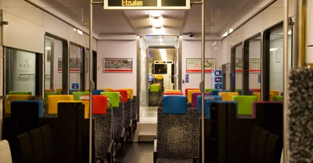 Vibrant seats inside a modern Swiss train in Etzwilen, Switzerland.