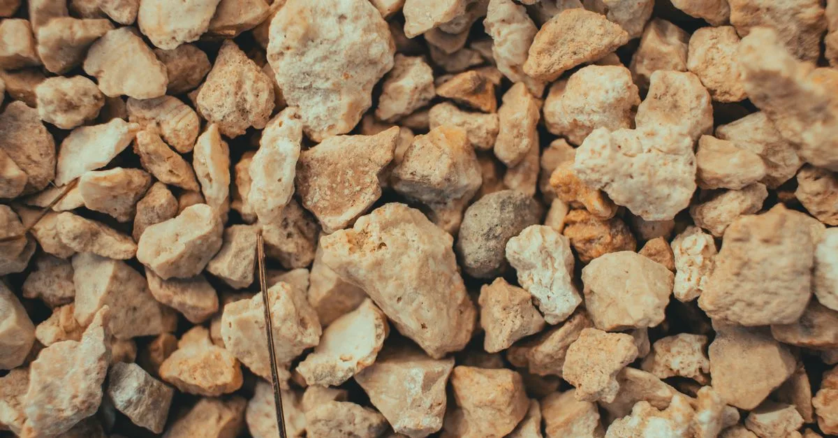 Detailed close-up of brown gravel and stones, showcasing texture and variety.