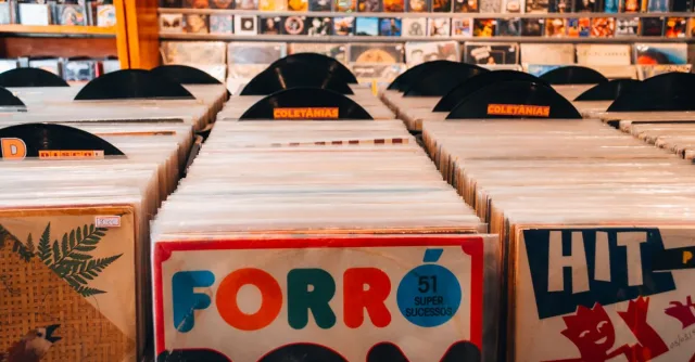 Rows of vintage vinyl records in a Brazilian music store, showcasing classic album art and retro vibes.
