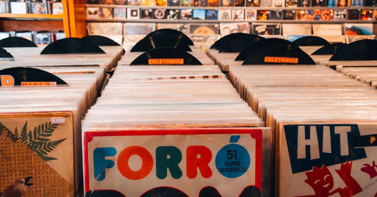 Rows of vintage vinyl records in a Brazilian music store, showcasing classic album art and retro vibes.