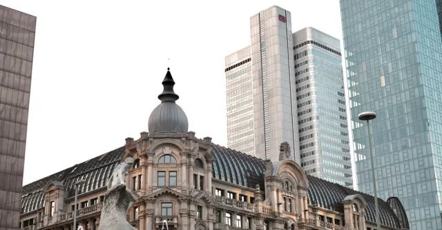 A blend of historic and modern buildings in Frankfurt's skyline, showcasing architectural diversity.