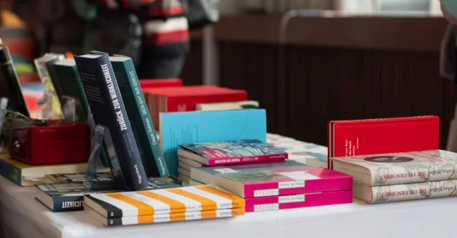 Explore a variety of books on display at a Stuttgart book fair event, perfect for literary enthusiasts.