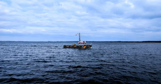 A patrol boat navigating the calm waters of the Baltic Sea near Wismar, Germany.